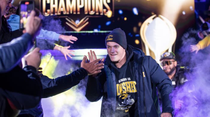 Michigan quarterback J.J. McCarthy celebrates the team’s national championship.
